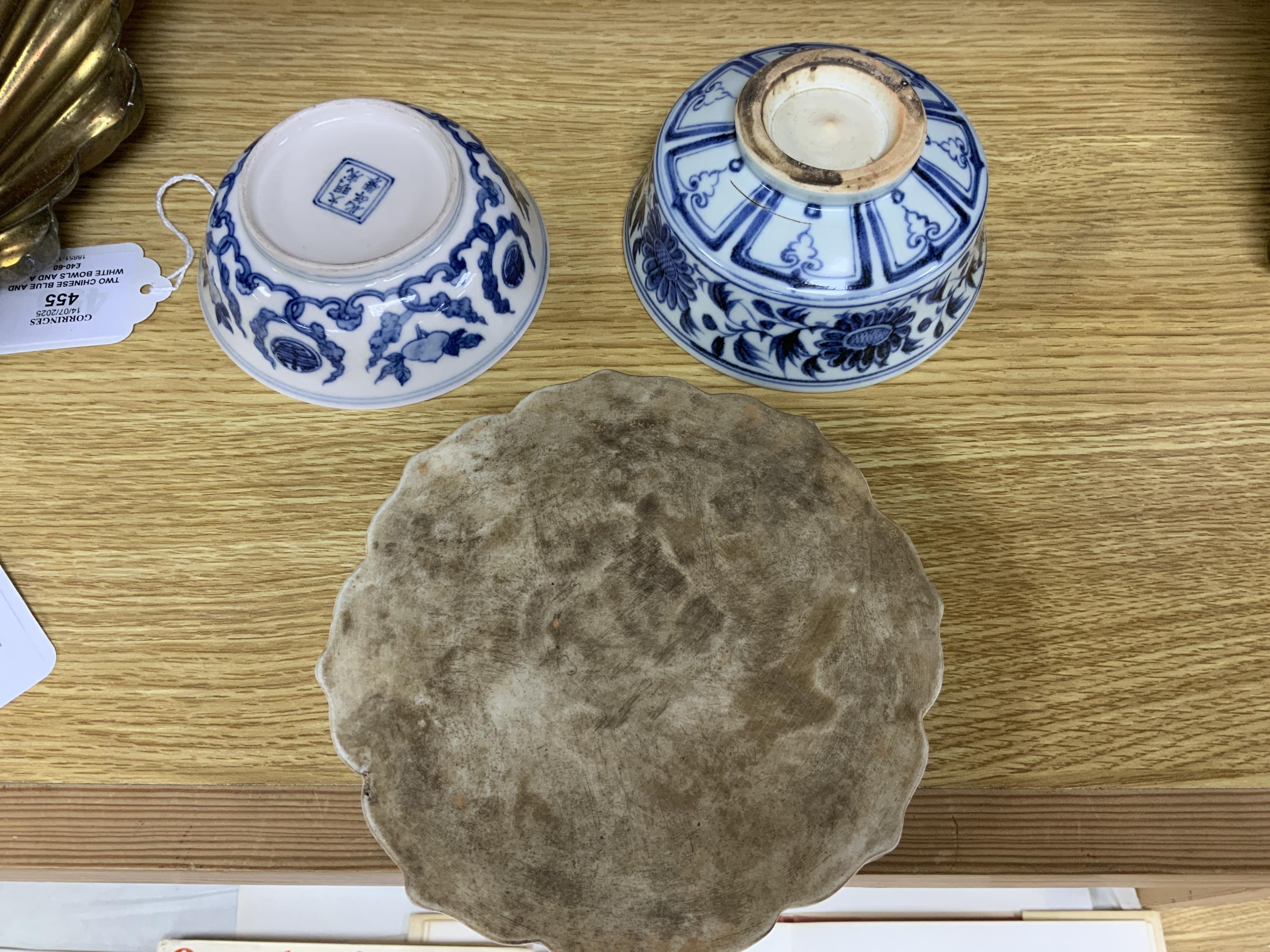 Two Chinese blue and white bowls and a lotus shaped tea pot stand, largest 15cm in diameter